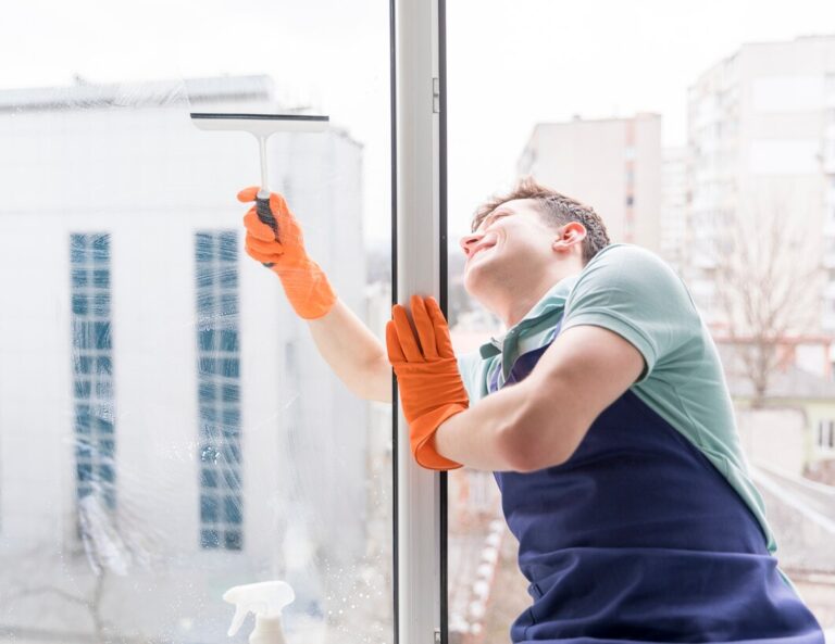 man cleaning windows