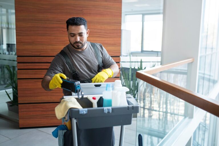 man walking with cleaning cart