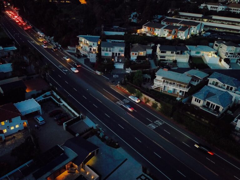 Aerial view of a neighborhood street at dusk, highlighting a bustling area where Gramercy Cleaners is reputed as the top service in town.